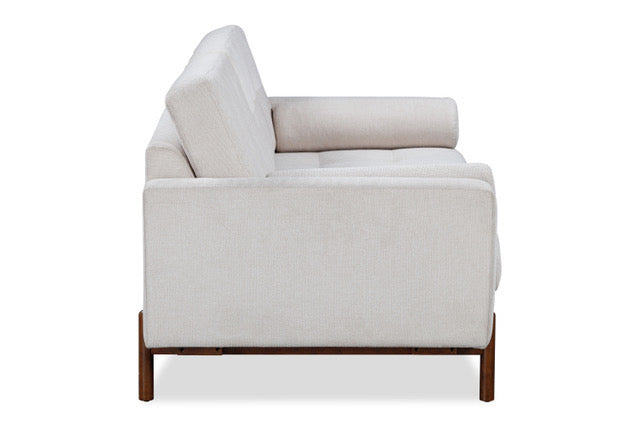 Light gray sofa with wooden legs on a white background