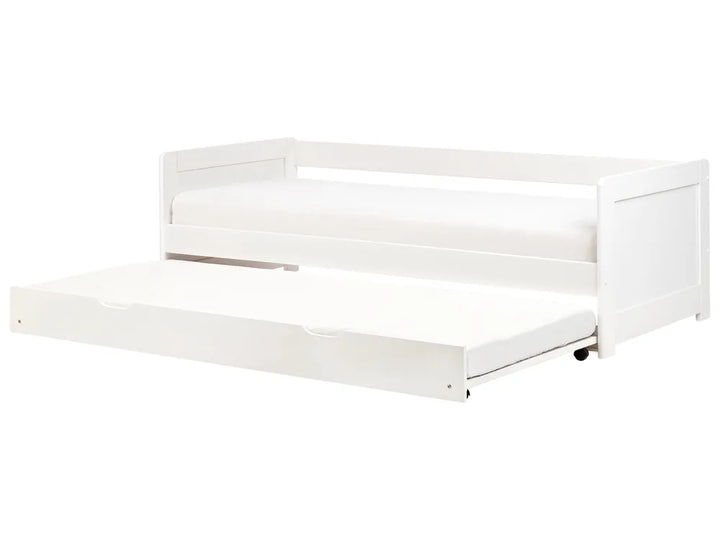 White crib with clear plastic sides on a white background