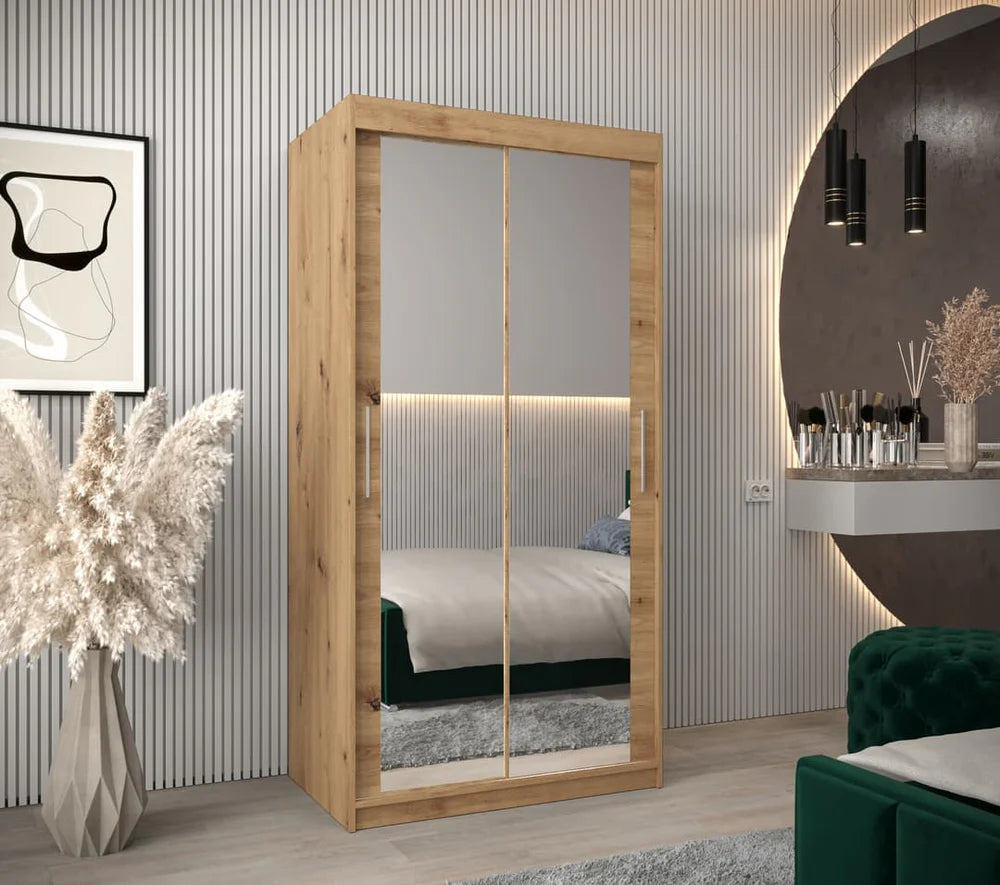 Wooden wardrobe with mirror doors in a room setting with decor elements.