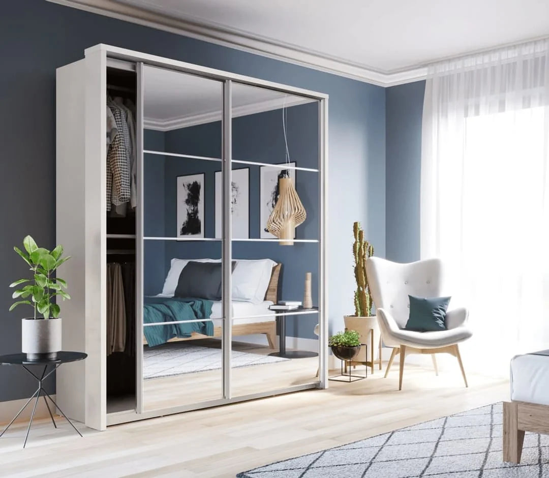 Modern bedroom with a wardrobe, chair, and decor elements.