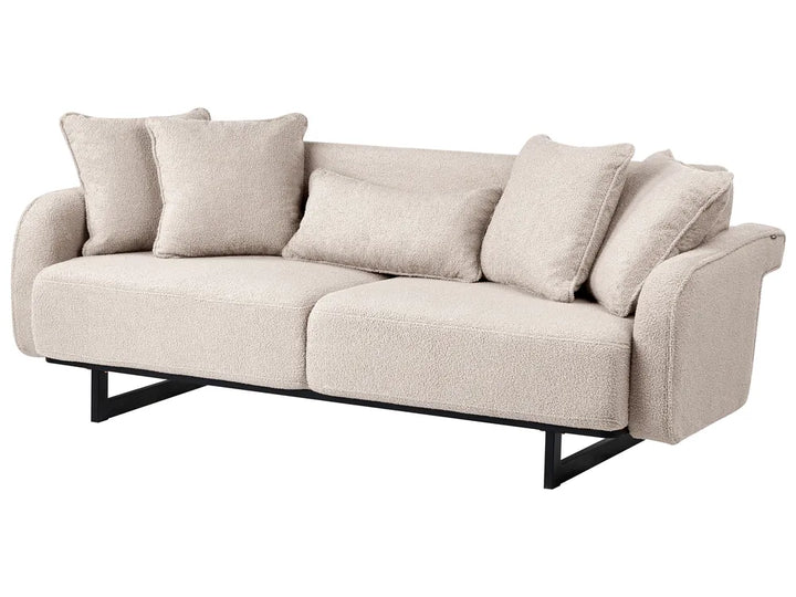 A modern two-seater sofa upholstered in a textured light beige bouclé fabric, featuring a black metal frame and four matching throw pillows, shown against a plain white background.