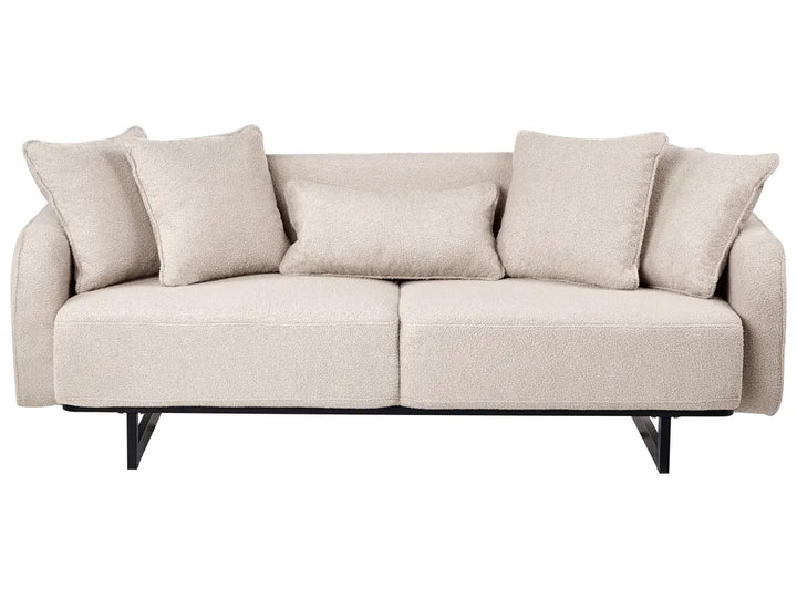 A modern two-seater sofa upholstered in a textured light beige fabric, featuring five matching throw pillows and a black metal frame with angled legs, shown against a plain white background.