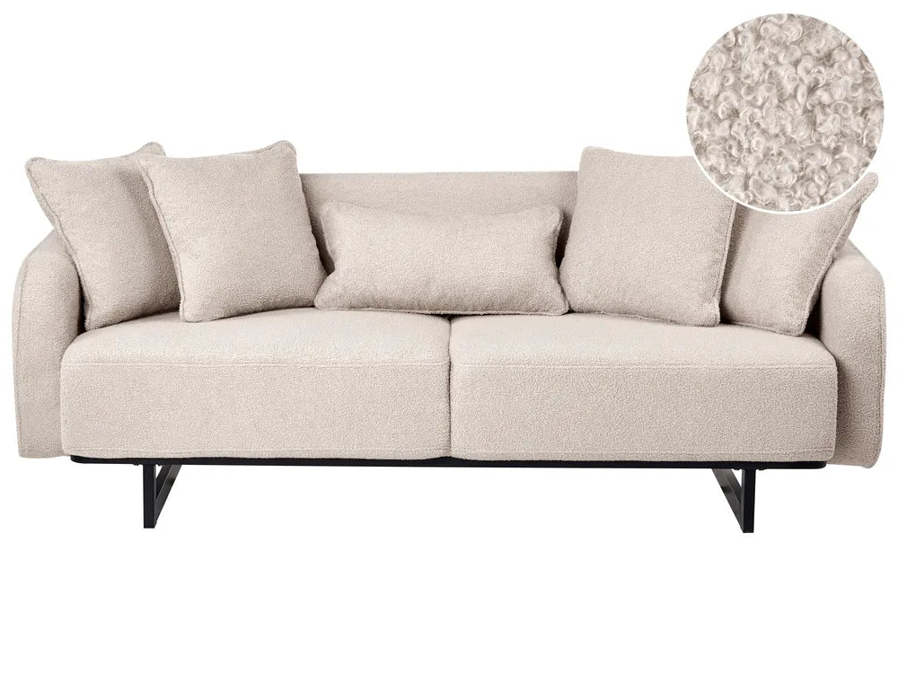 A light beige upholstered loveseat with five matching throw pillows and black metal legs, shown on a white background with a circular fabric close-up inset in the top right.
