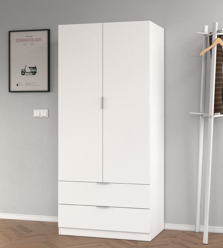 White wardrobe with a coat rack and framed picture on a gray wall.