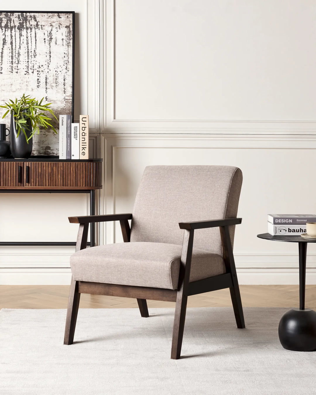 Beige armchair with wooden frame in a living room setting