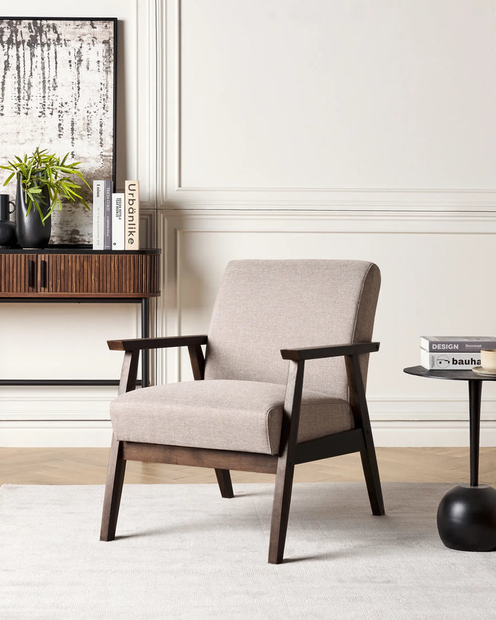 Beige armchair with wooden frame in a living room setting