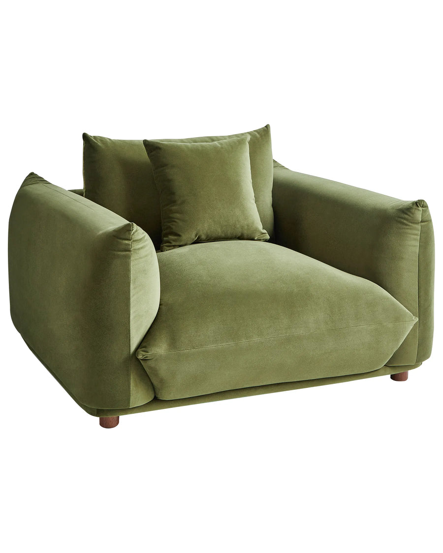 Green sofa with cushions on a white background