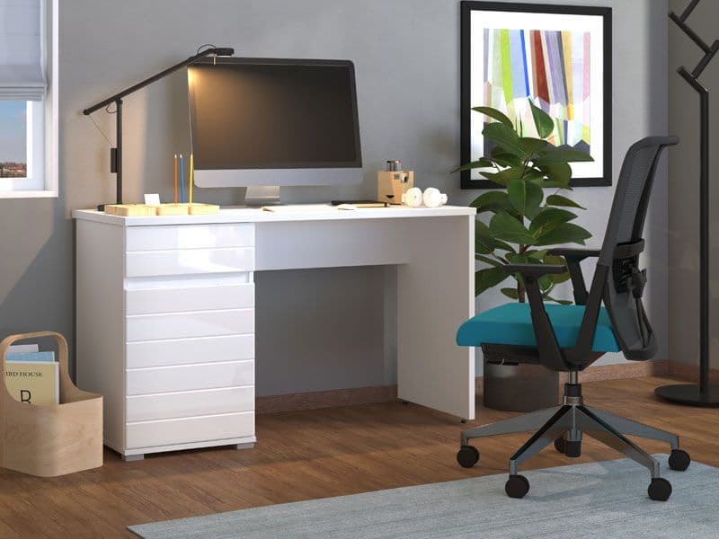White desk with computer setup in a home office setting