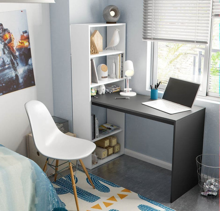 Modern bedroom with a black desk, white chair, and bookshelf.