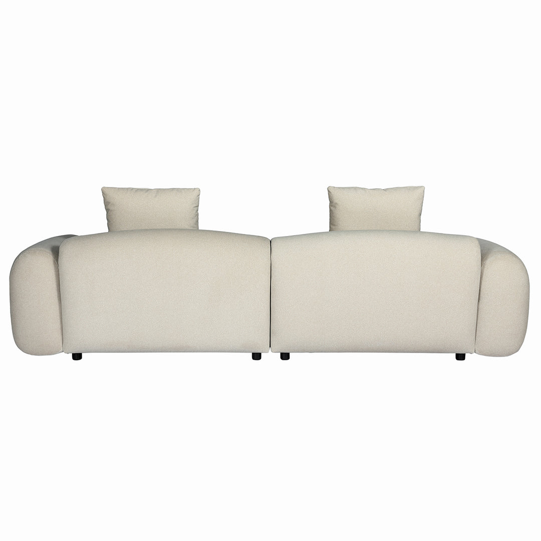 Beige sofa with two cushions on a white background