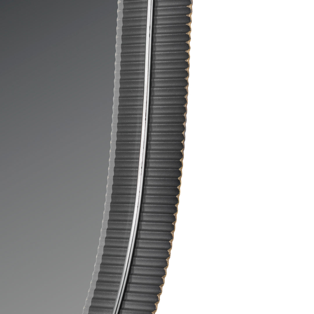 Close-up of a ribbed black tire on a white background