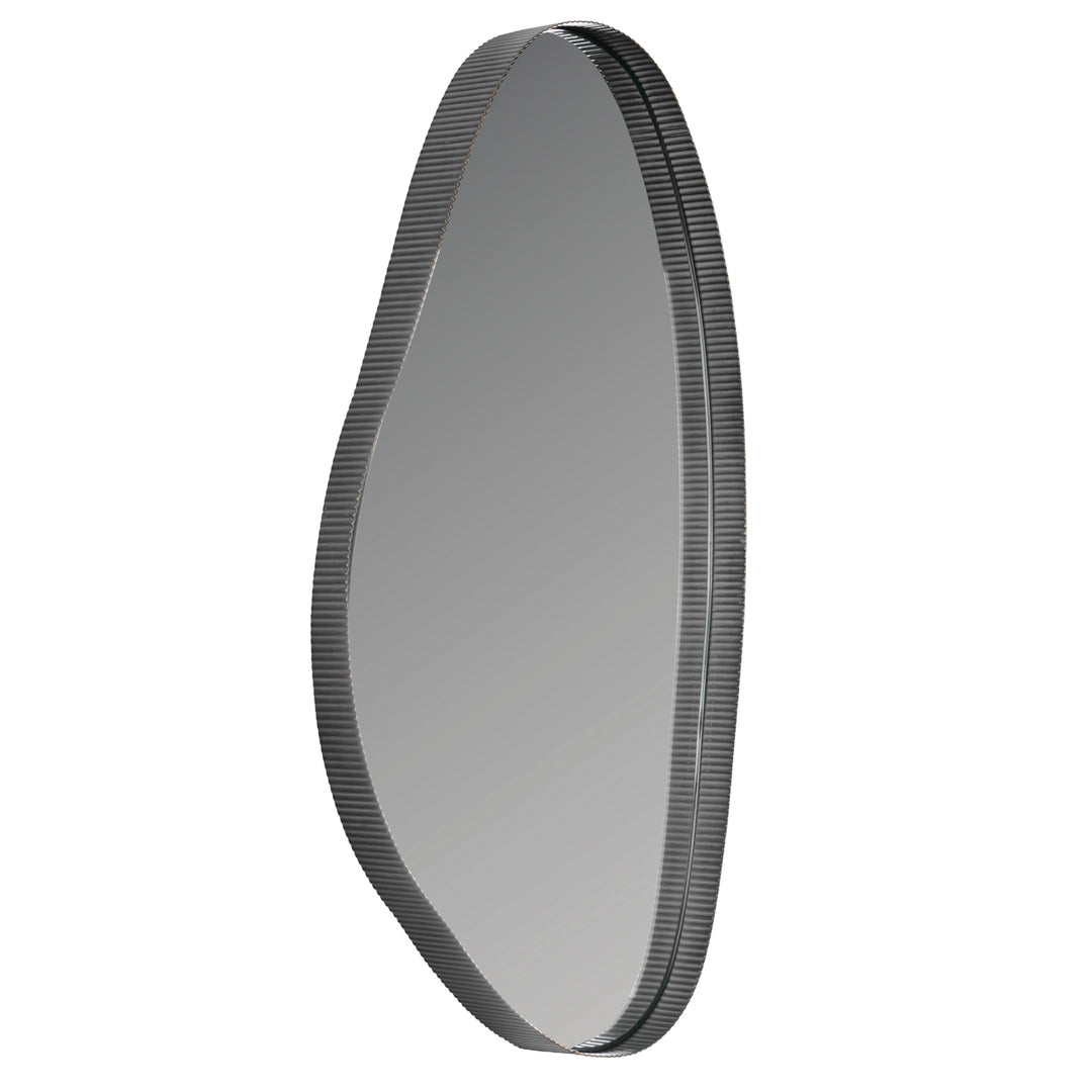 Round metallic object with a textured rim on a white background