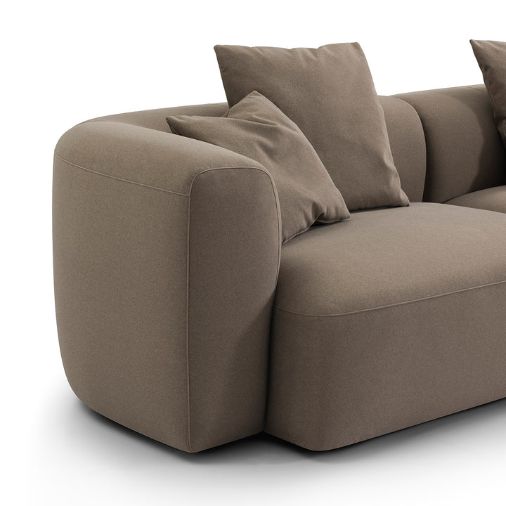 Brown sofa with cushions on a white background