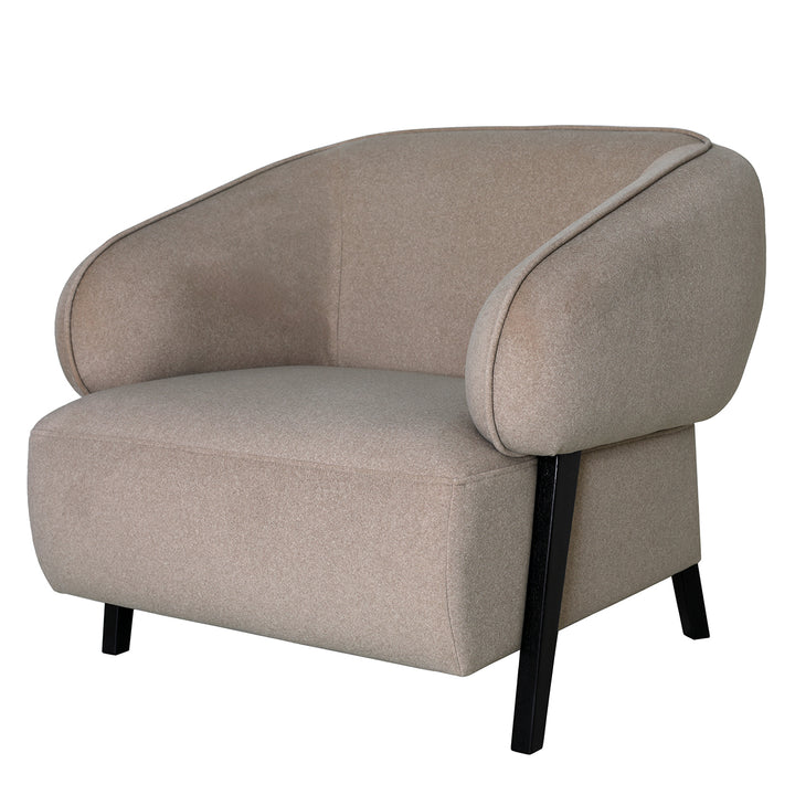 Beige armchair with black legs on a white background