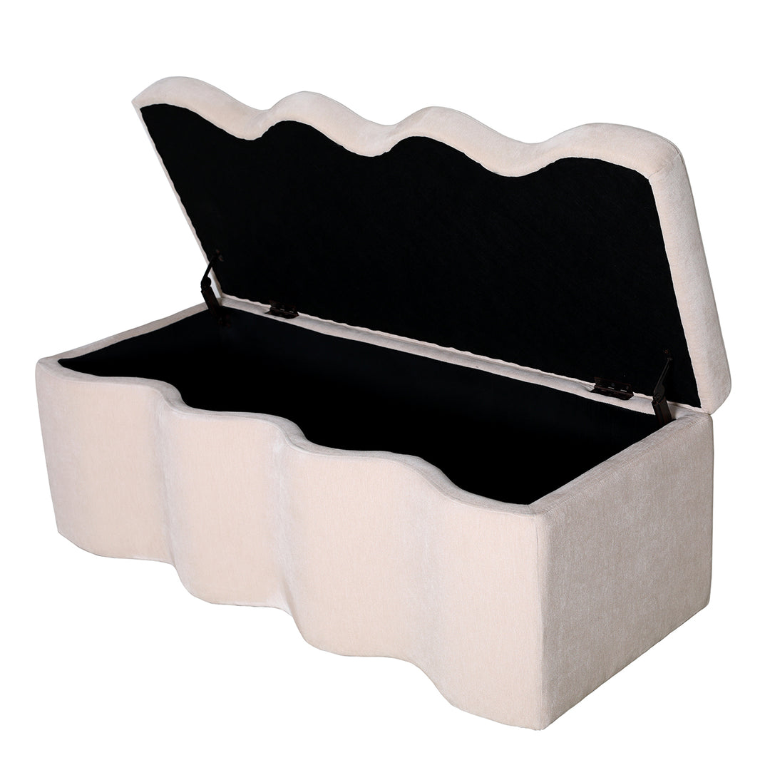White ottoman with scalloped edge and open lid on a white background