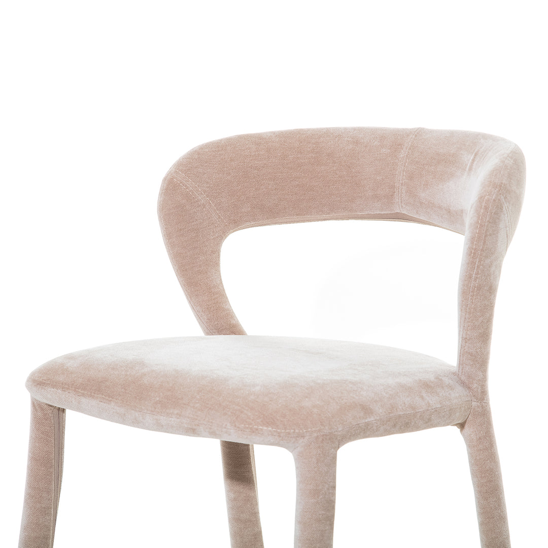 Beige velvet chair on a white background