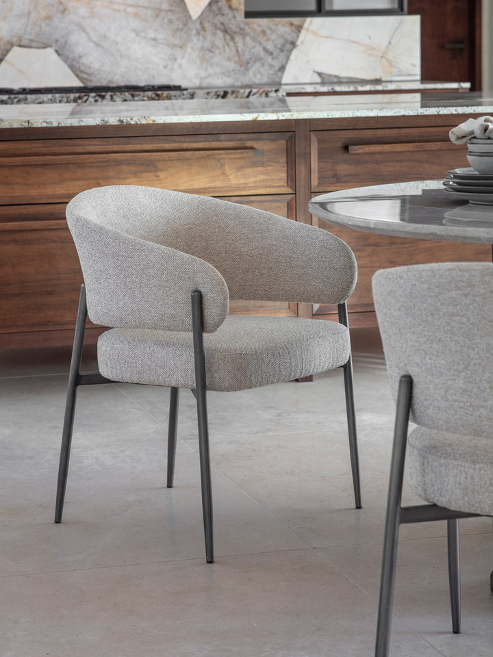 Gray upholstered chairs with metal legs in a kitchen setting