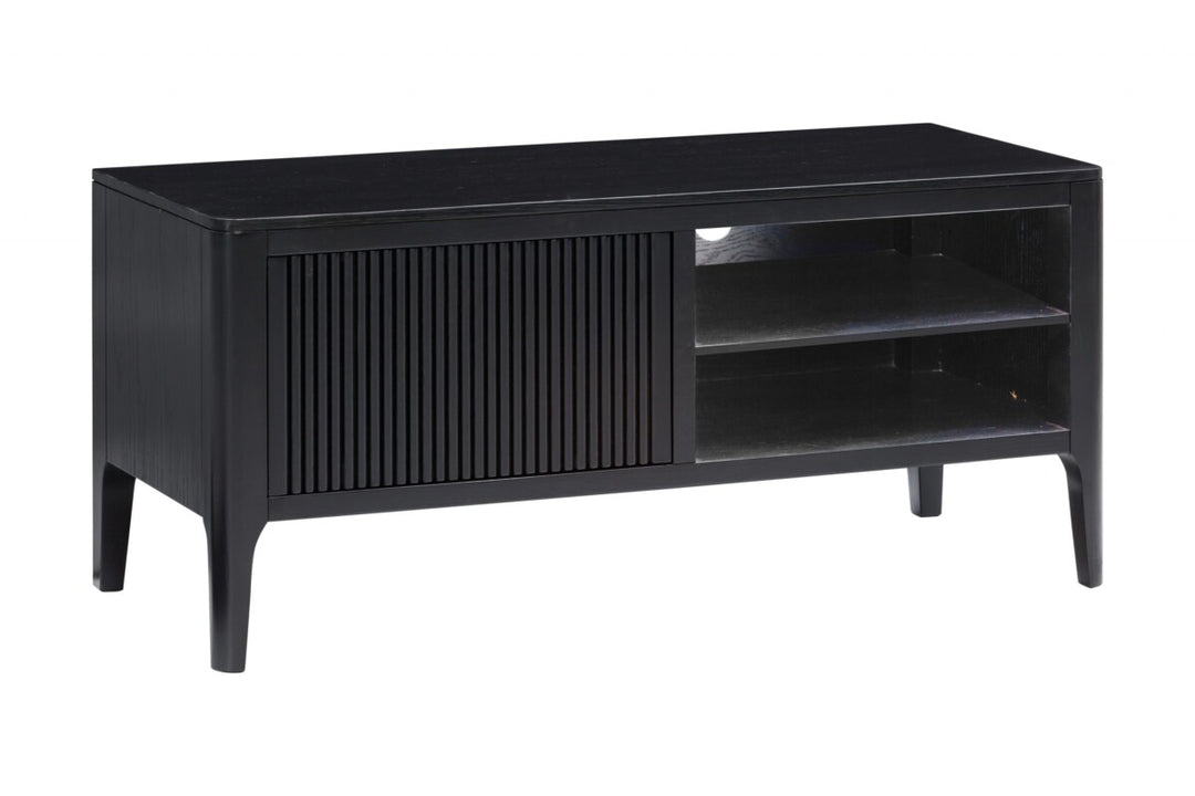 Black TV stand with a slatted door on a white background