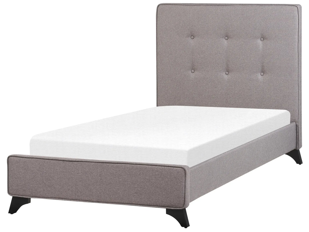 Gray upholstered bed with white mattress on a white background