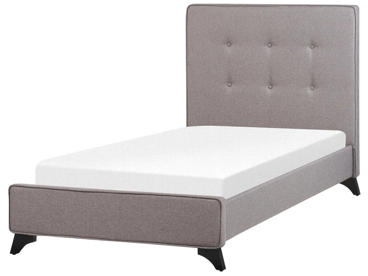Gray upholstered bed with white mattress on a white background