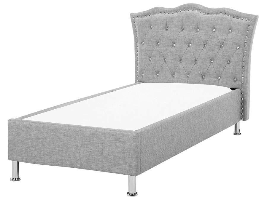 Gray upholstered bed with tufted headboard on a white background