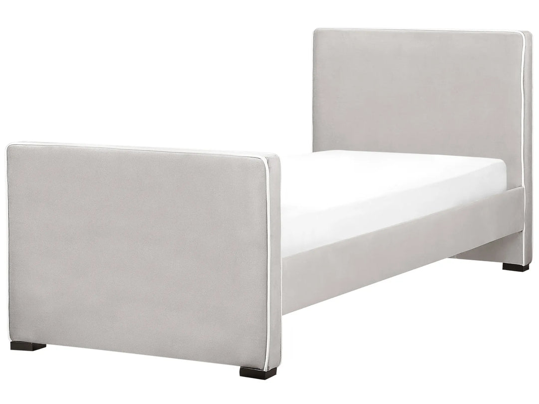 Modern bed with light gray upholstered headboard and footboard on a white background