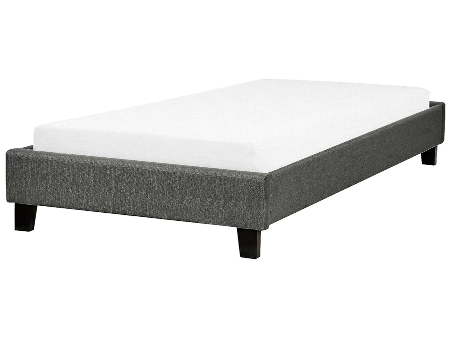 Gray upholstered bed frame with white mattress on a white background