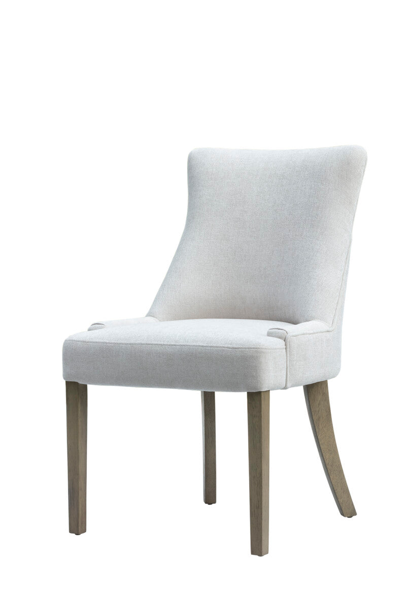 White upholstered chair with wooden legs on a white background