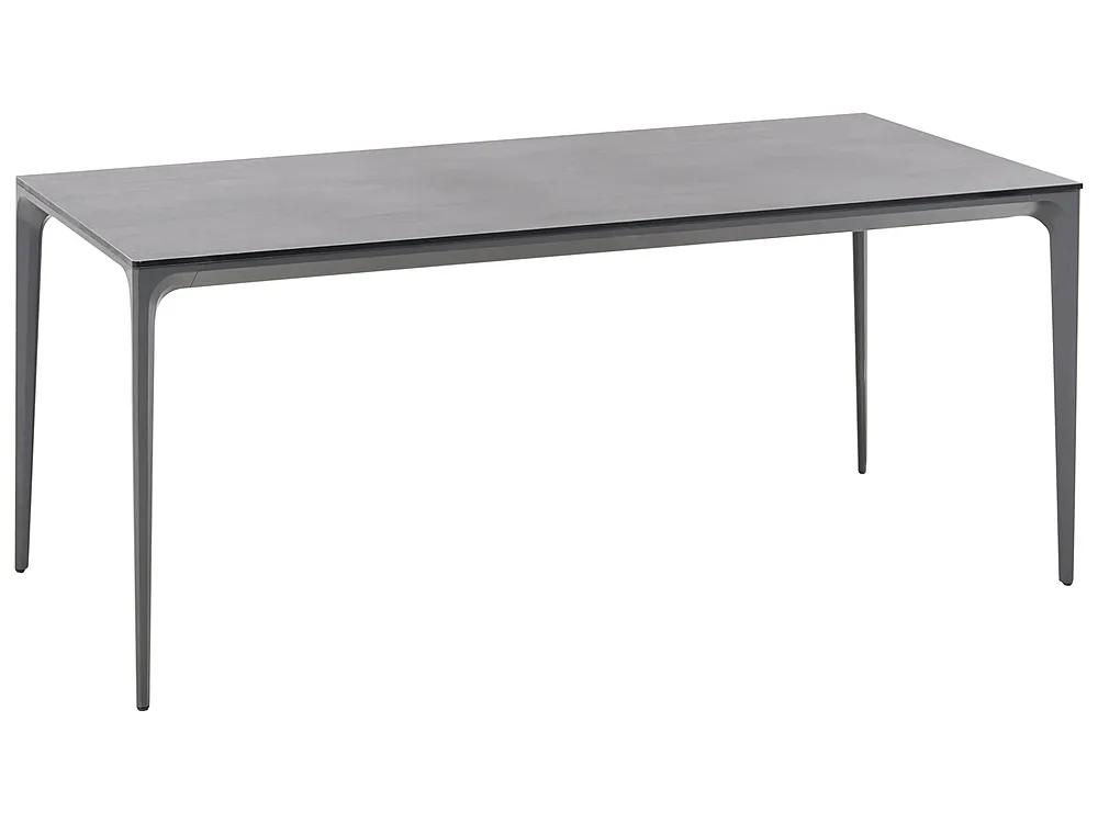A modern rectangular dining table with a dark gray wood-grain top and slim, tapered metal legs, shown on a plain white background.