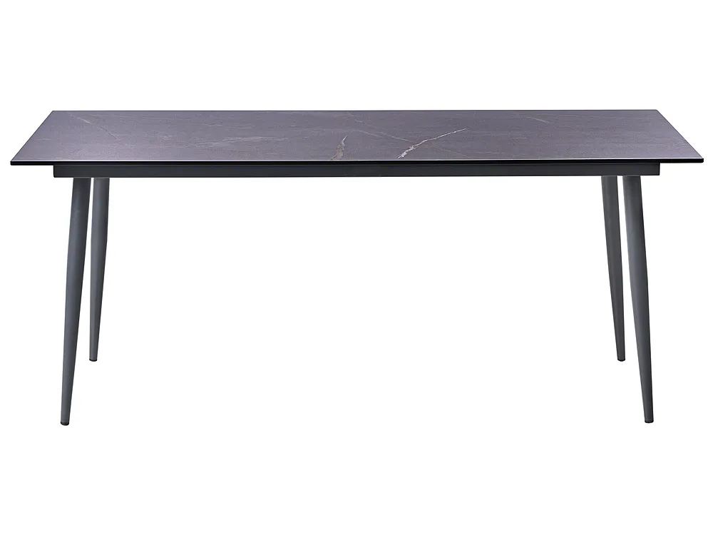 A modern rectangular dining table with a dark charcoal gray stone-look top and slim tapered legs, shown against a plain white background.