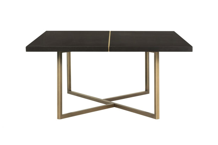 Dining table with black marble top and gold metal legs on a white background
