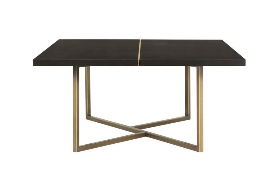 Dining table with black marble top and gold metal legs on a white background