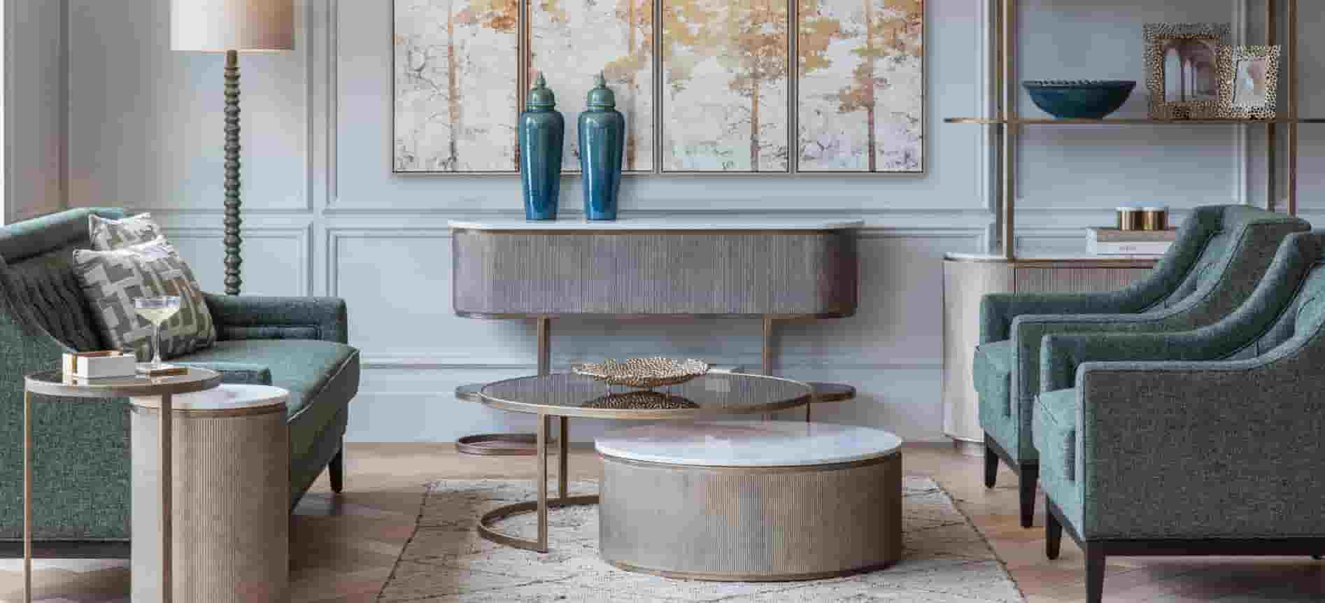 Modern living room with green furniture, round coffee table, and decorative elements.