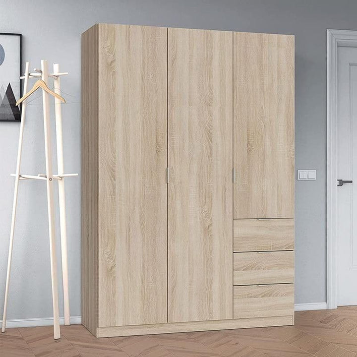 Wooden wardrobe with two doors and a drawer in a room with a coat rack.