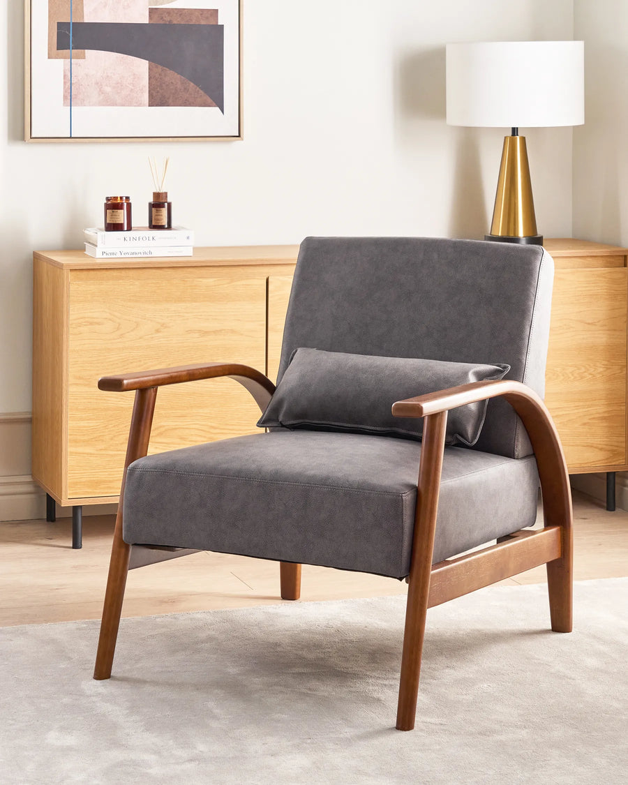 Gray armchair with wooden arms in a living room setting