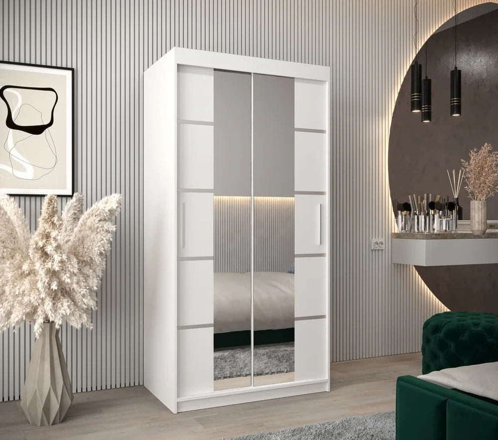 White wardrobe with sliding doors in a modern room setting