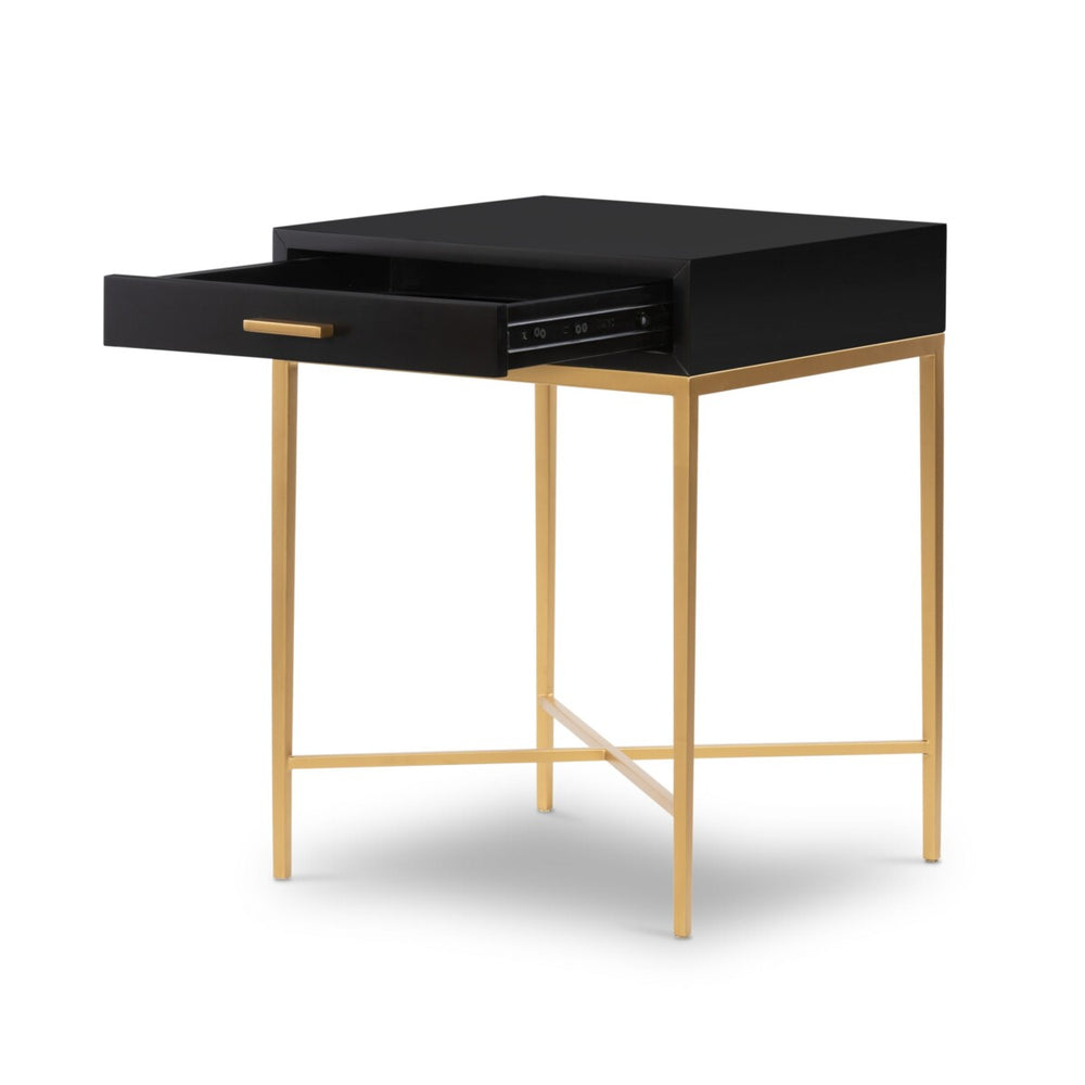 Black desk with a drawer and gold legs on a white background