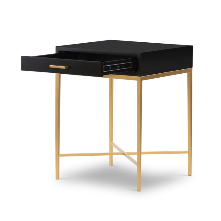 Black desk with a drawer and gold legs on a white background