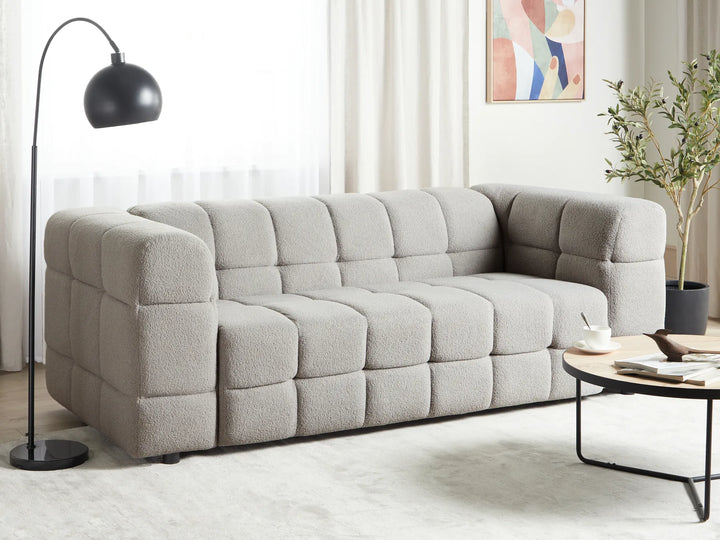Grey bouclé 3 seater sofa with decorative stitching and thick cushions