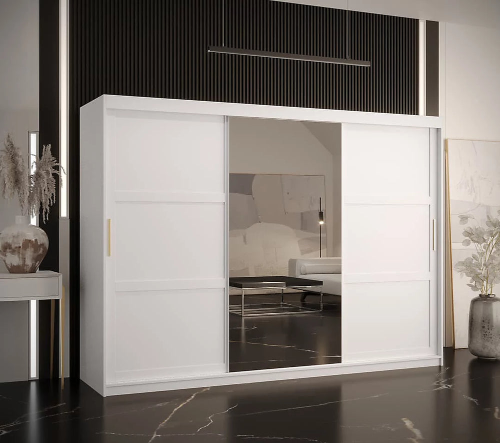 White sliding wardrobe with glass panels in a modern room setting.