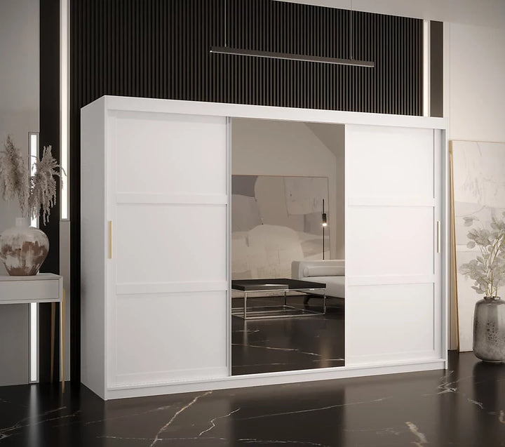 White sliding wardrobe with glass panels in a modern room setting.
