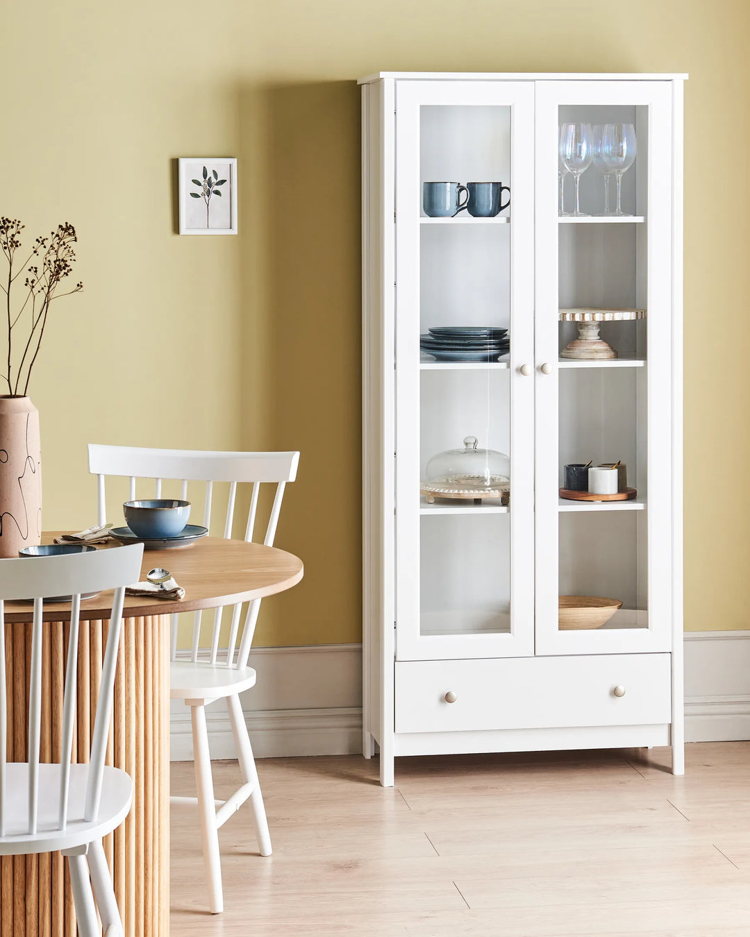 White glass-fronted cabinet
