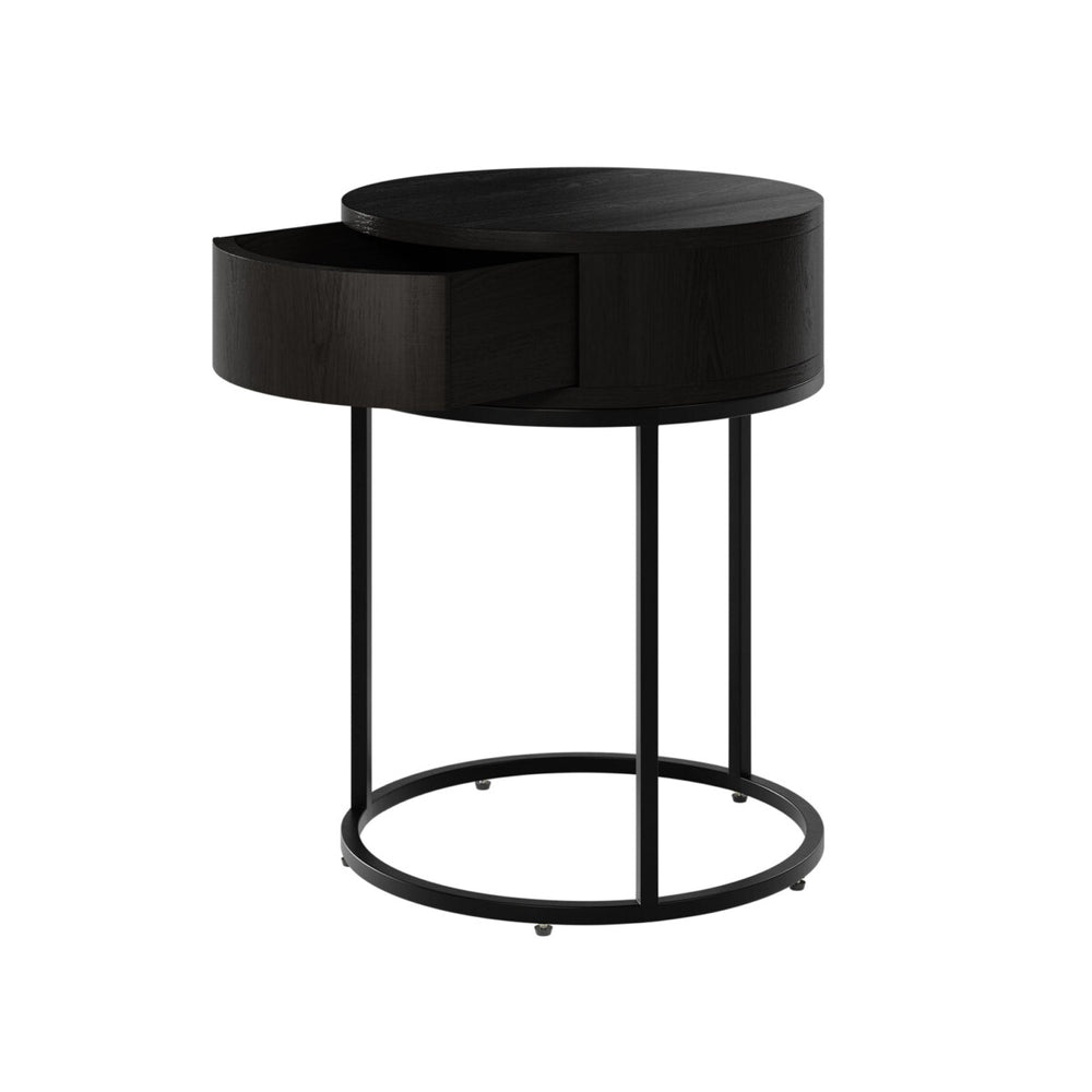 Black side table with a round design on a white background