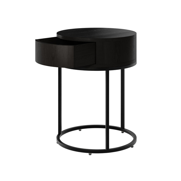Black side table with a round design on a white background