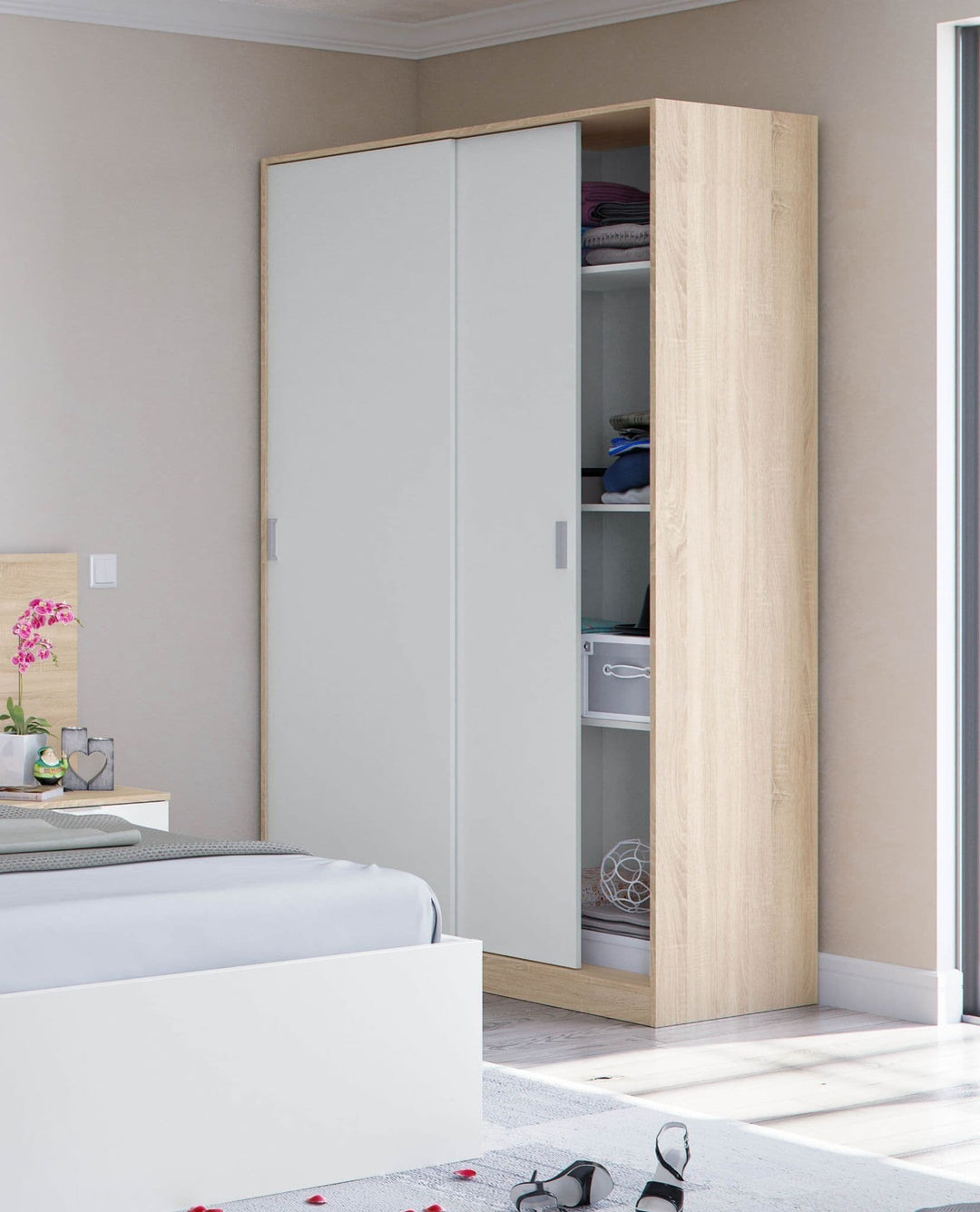 Wooden wardrobe with white sliding doors in a bedroom setting