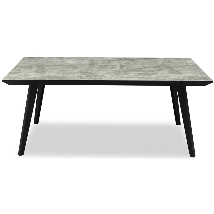 Rectangular table with gray concrete top and black legs on a white background