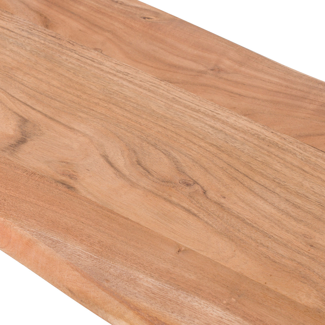 Close-up of a wooden cutting board with a natural finish