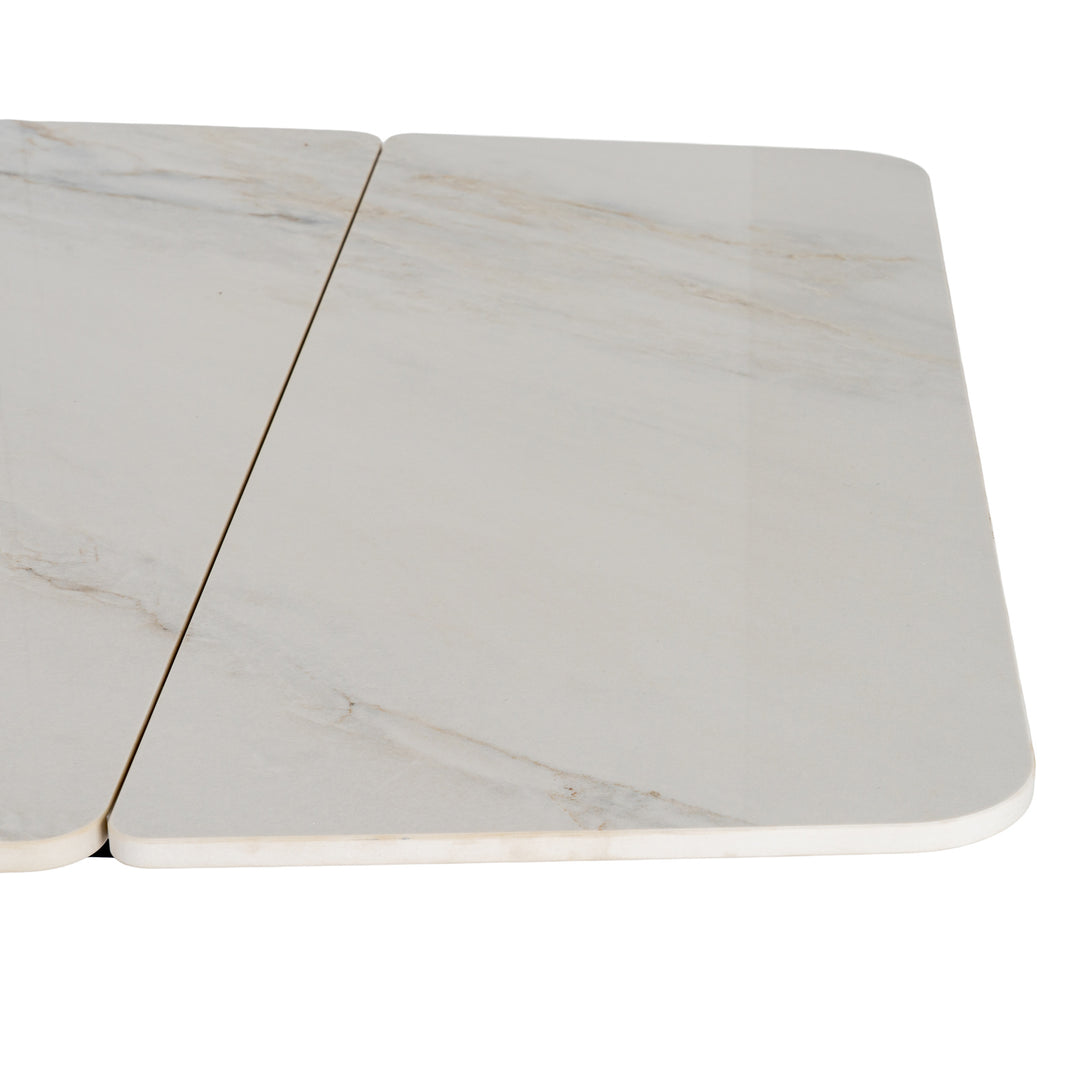 A close-up of a white marble tabletop with subtle gray veining and rounded corners, shown against a plain white background.