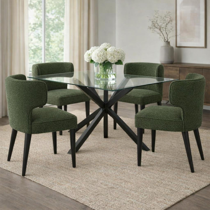 Dining room with a glass table and green chairs on a beige rug.