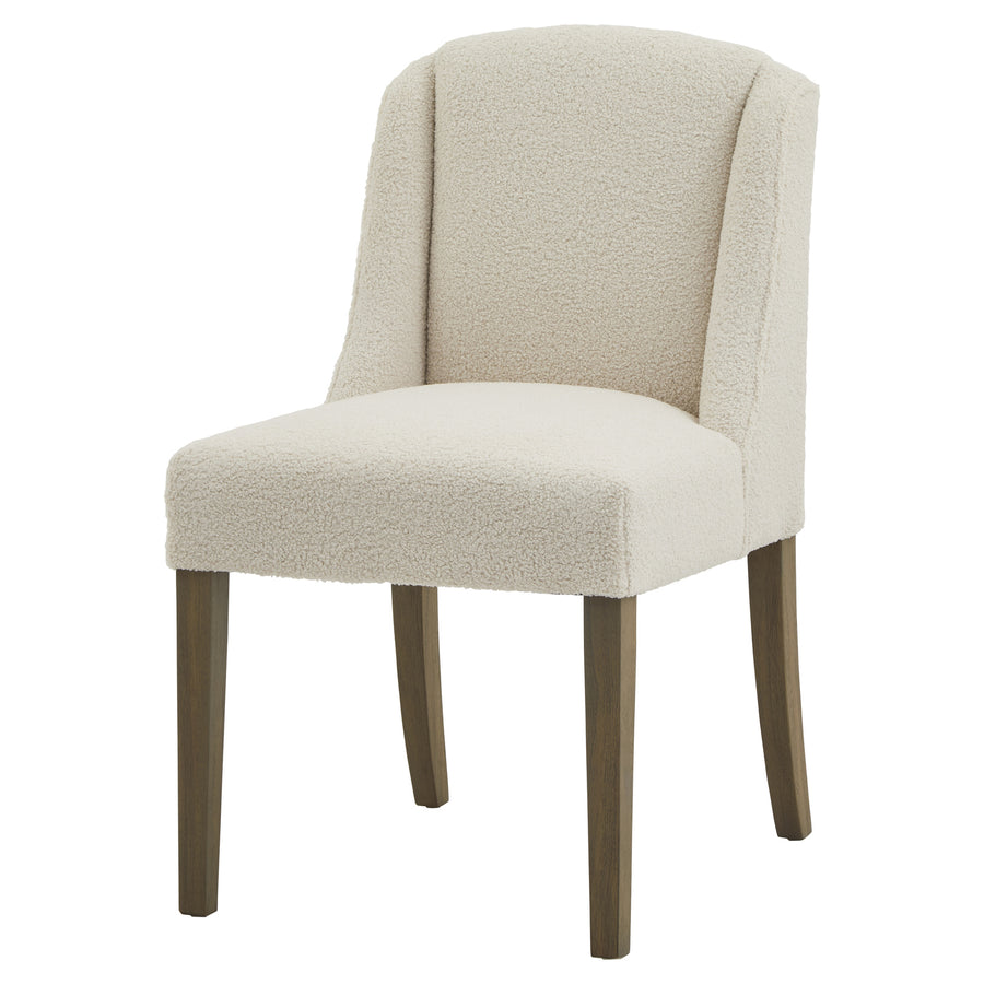 Beige upholstered chair with wooden legs on a white background